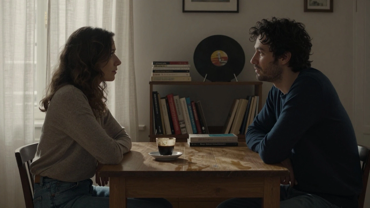 Two people sit quietly across from each other in a Parisian apartment, enjoying coffee and stillness.